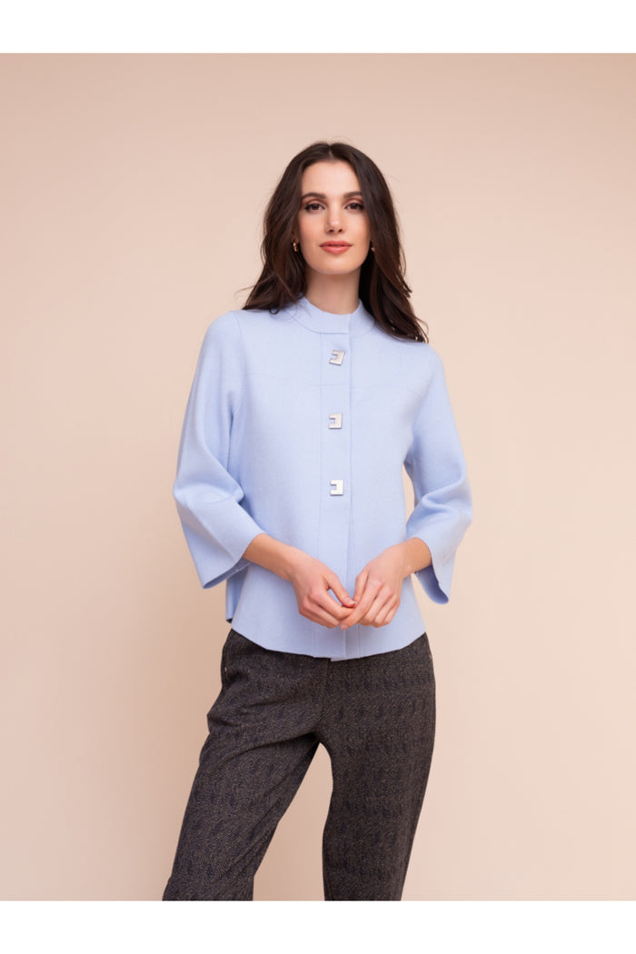 Model wearing the Alison Sheri A48211 Knit Top Ice Blue with unique buttons and 3/4 sleeves, shop Alison Sheri at Dotique.