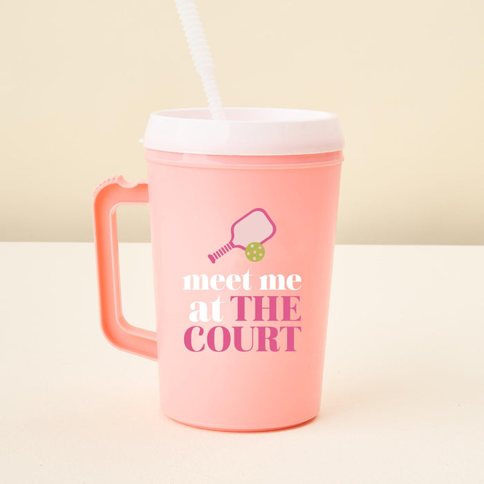 The-darling-effect Meet Me on the Court 34 oz Mega Mug: a pink plastic tumbler with handle, white lid and straw, plus a paddle and ball graphic above "meet me at THE COURT"βideal for hydration on or off the court.