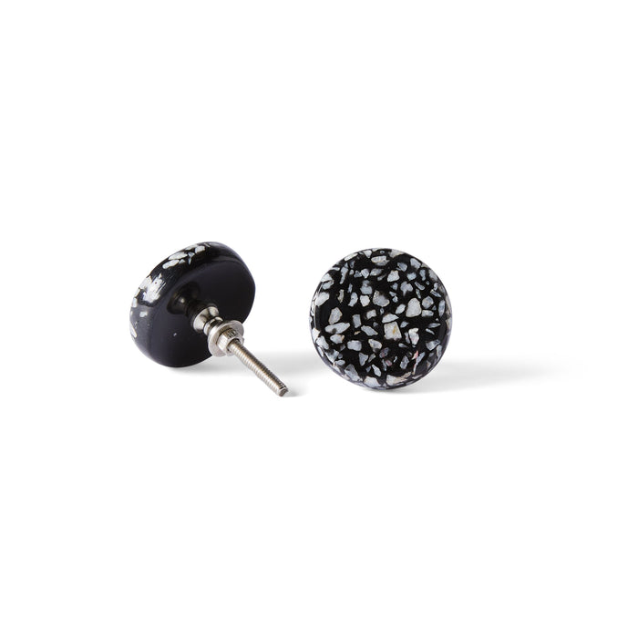 Two Speckle Black and White Knob 4.4cm earrings are shownβone flat, one upright to reveal the metal postβfeaturing round, black design with white speckled patterns reminiscent of terrazzo.
