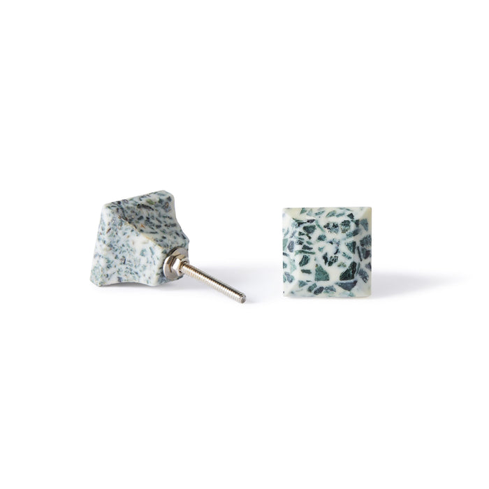 A pair of Speckle Square Knob 3.5cm earrings with a blue and white terrazzo lookโone lays flat, the other stands upright to show the metal post, ideal for fans of colorful cabinet hardware-inspired style.