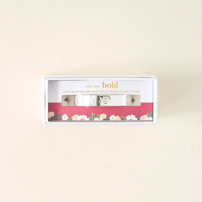 The Darling Effect's You Are Bold Cuff Bracelet comes in a white box with a floral design and the message: You are bold. Love who you are and forget what others thinkβmaking it a meaningful gift for someone special.