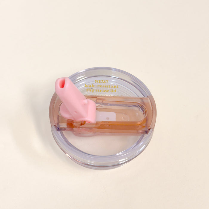 The Darling Effect 20 oz Light Pink Lifestyle Flip Straw Replacement Lid features a pink flip straw, light brown accent, and "NEW! leak-resistant seal for your flip straw tumbler" text on a plain white background.