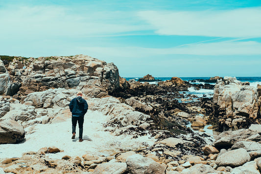 A Person Hiking in Nature Along The Oceanside In Monterey California