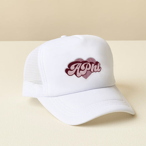 The Darling Effect Alpha Phi White Trucker Hat features APhi in maroon script on the front, displayed against a neutral background.
