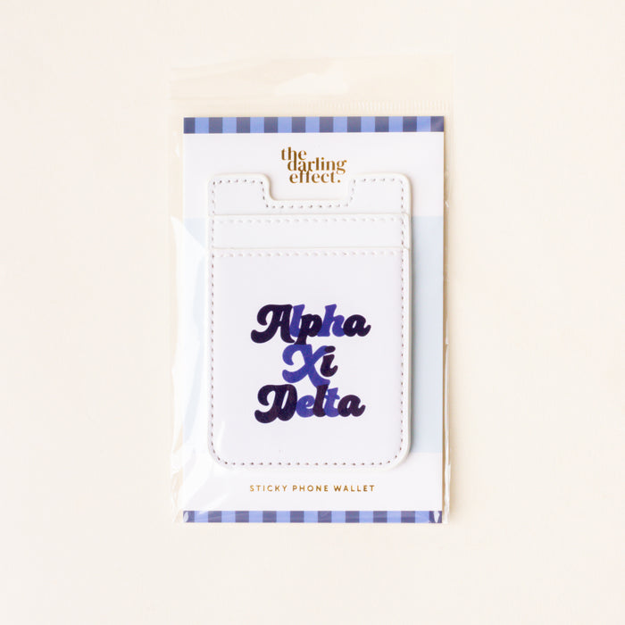 The Alpha Xi Delta Stick-On Phone Wallet by The Darling Effect features navy blue cursive lettering, a blue and white striped border, and comes in packaging—making it an ideal sorority gift.