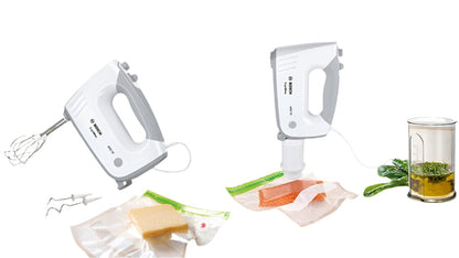 Two hand mixers on a wooden surface with ingredients and kitchen tools.