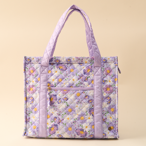 The-darling-effect’s Bouquet Beauty Purple The Everyday Quilted Tote Bag features a lavender quilted design with a ditsy floral print, top handles, and a front zippered pocket for easy organization.