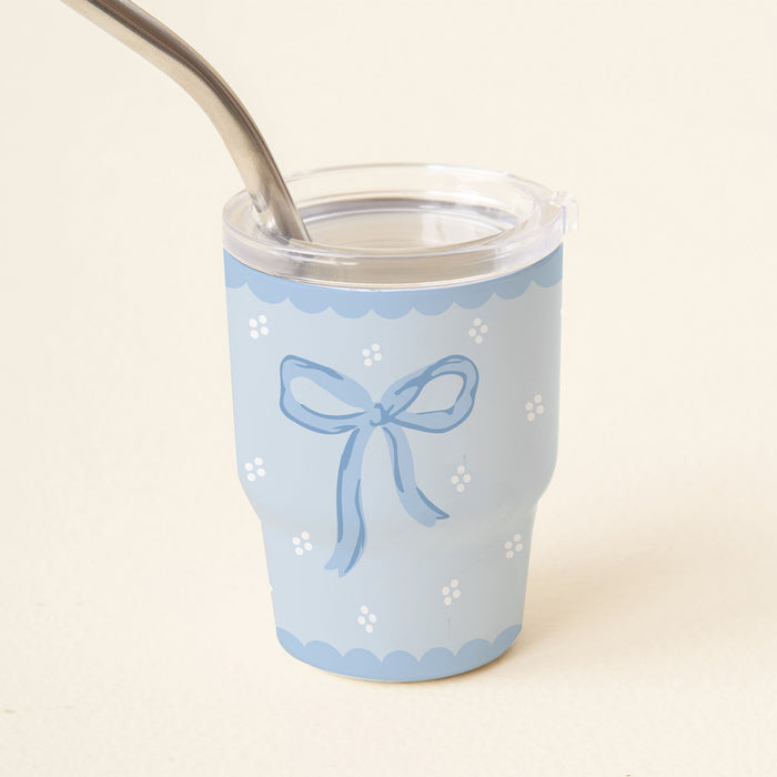 The Bow Blue 2 oz Tiny Tumbler by the-darling-effect is a cute light blue mini cup with a clear lid, metal straw, white polka dots, and a blue bow.