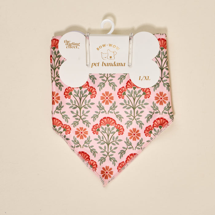 The Darling Effect Bow-Wow Pet Bandana-Everbloom Dusty Rose features a pink cotton fabric with a red and green floral print, displayed in L/XL size packaging—ideal for elevating your pet’s style.