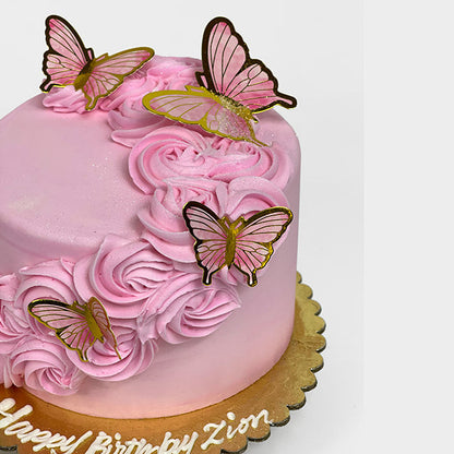 Pink Butterflies and Rosettes Cake decorated with pink and gold butterflies