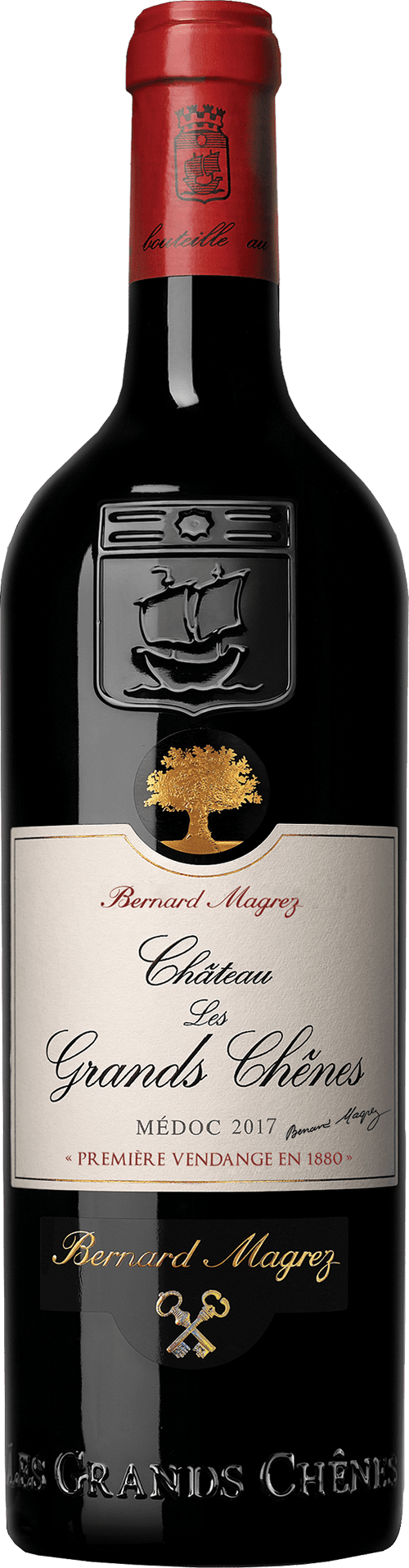 Bottle of Château Les Grands Chênes wine with a red label on a white background