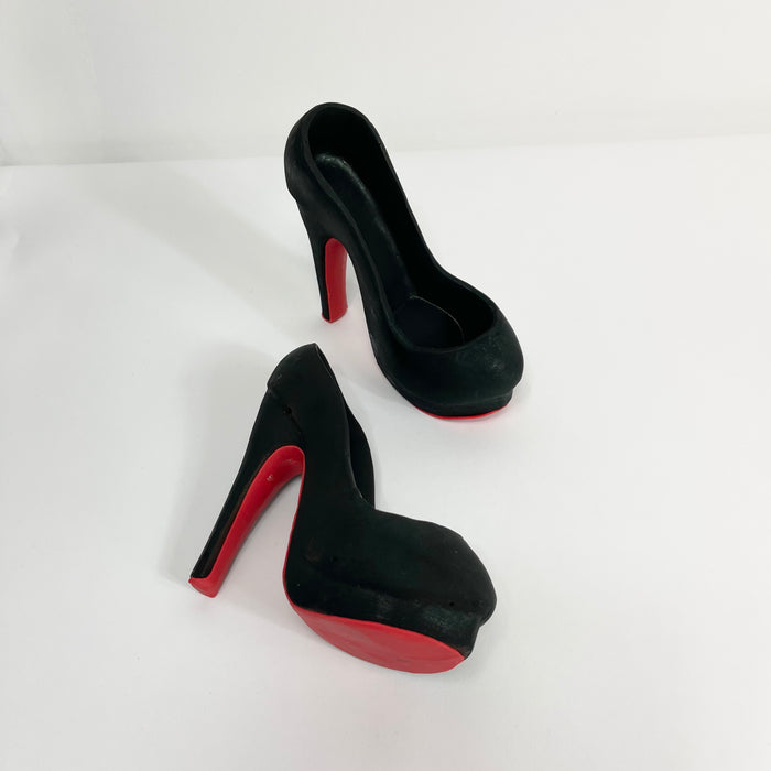 Our signature platform shoe in solid black chocolate with a trendy red bottom.