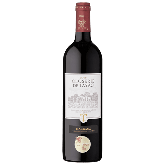 Bottle of Closérie de Tayac Margaux wine on a green background