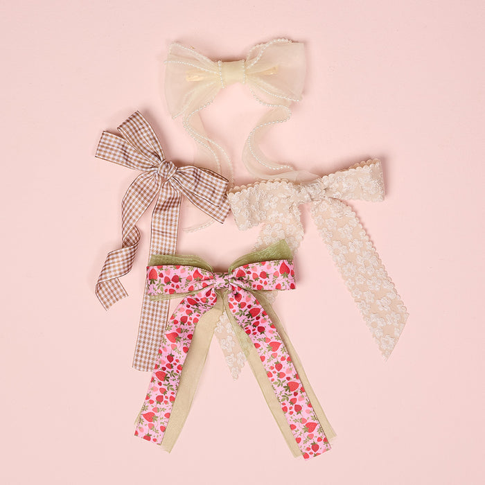 The-darling-effect Cream Sheer Pearl Hair Bow features delicate pearls—perfect for styling with your favorite bow clip or adding a charming touch to any hairstyle.
