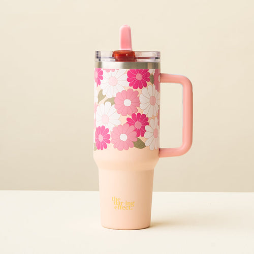 The-darling-effect Daisy Craze Hot Pink 40 oz Tumbler features a handle, floral pink and white daisy design, clear leak-resistant lid, pink flip straw, and “the drying effect” printed near the base.