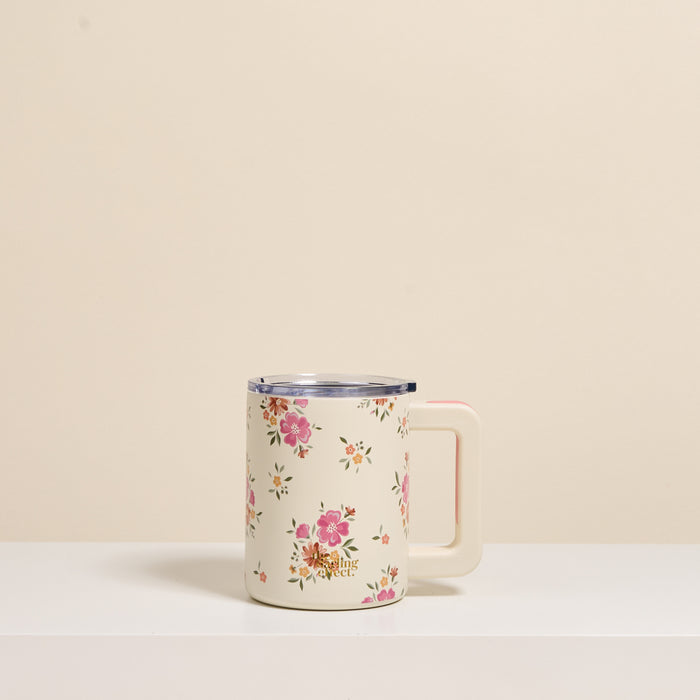 The Darling Effect Endless Daydream Cream 14 oz Insulated Mug features a vintage pink and coral floral design, cream handle, clear lid, and double-wall insulation to keep drinks hot or cold. The Darling Effect logo is displayed.