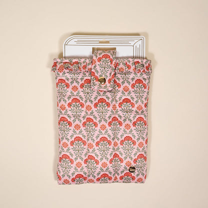 The Everbloom Dusty Rose Book Cover features a pink and red floral pattern, puffy polyester protection, a snap button closure, and charming hints of white pages with black lines on a light beige background.