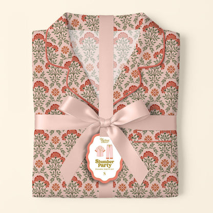 The Darling Effect's Everbloom Dusty Rose Slumber Party Pajama Pants Set features ultra-soft, floral-patterned fabric, neatly folded and tied with a pale pink ribbon—gift-ready for any occasion.