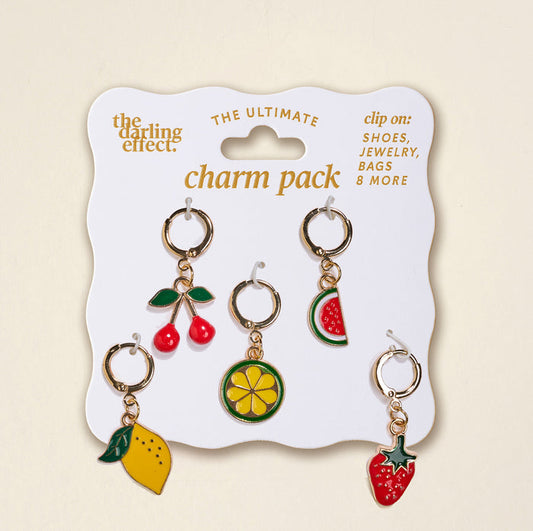 The Darling Effect’s Fruit Frenzy The Ultimate Charm Pack includes five gold hoop fruit charms—cherry, lemon slice, watermelon slice, lemon, and strawberry—perfect for charm packs or pairing with statement necklaces.