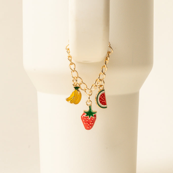 Add a playful touch to your cup with the-darling-effect Fruit Fusion Tumbler Charm, a gold chain bracelet featuring banana, watermelon, and strawberry charms—a fun drinkware accessory to brighten your favorite tumbler.