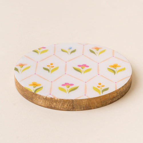 The-darling-effect's Handpicked for You Wood Enamel Coaster features a white enamel top with a geometric floral and green leaf pattern—making it a charming decorative addition to your coaster collection.