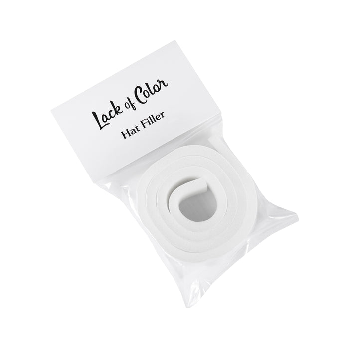 White foam hat filler in packaging labeled 'Lack of Color Hat Filler'
