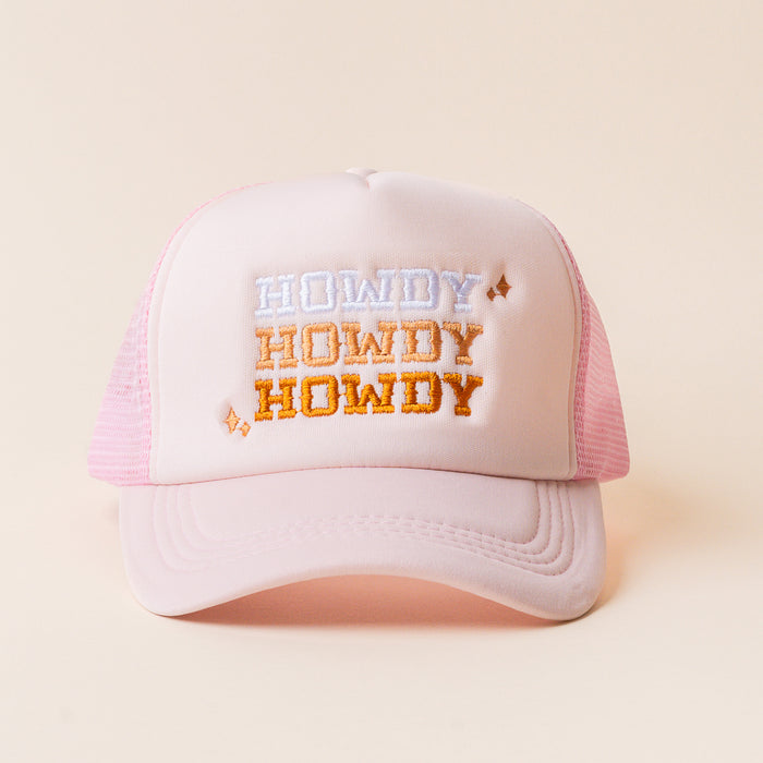 The Howdy Howdy Howdy Trucker Hat by the-darling-effect features light pink fabric and "HOWDY" embroidered in white and orange shades—ideal for fans of trendy or embroidered hats.