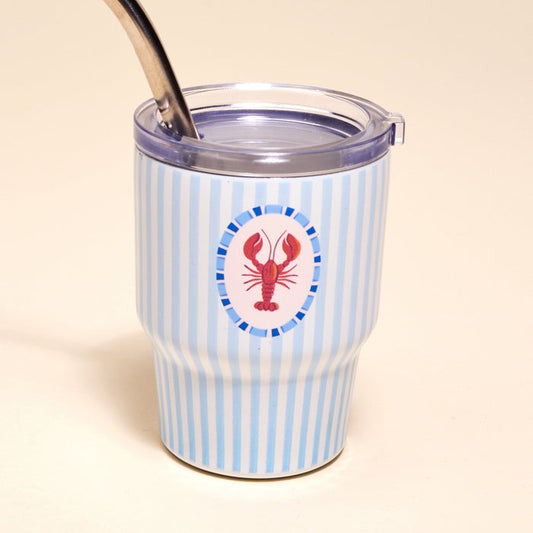 Sip in style with The Darling Effect’s Lobster 2 oz Tiny Tumbler, featuring blue and white stripes, a red lobster emblem, and a metal straw.