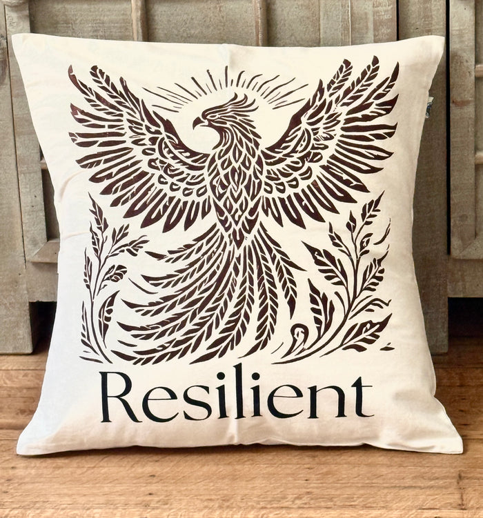 20" x 20" Decorative cotton Canvas pillow with a Rising Phoenix design and the word 'Resilient'. Hand-sewn & Hand-printed by Women Survivors in Kolkata, India.