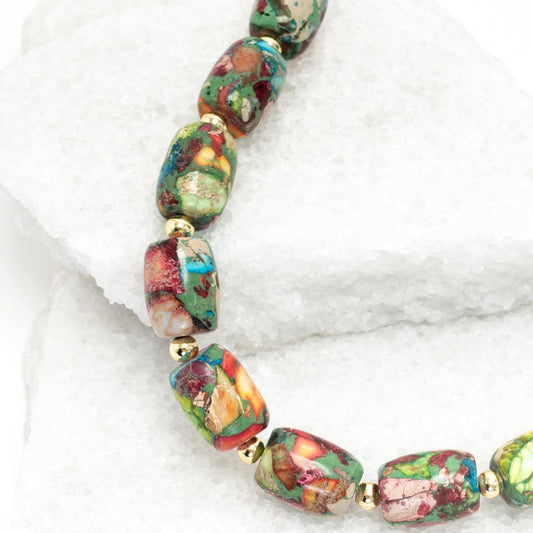 Multicolored beaded bracelet on a white background