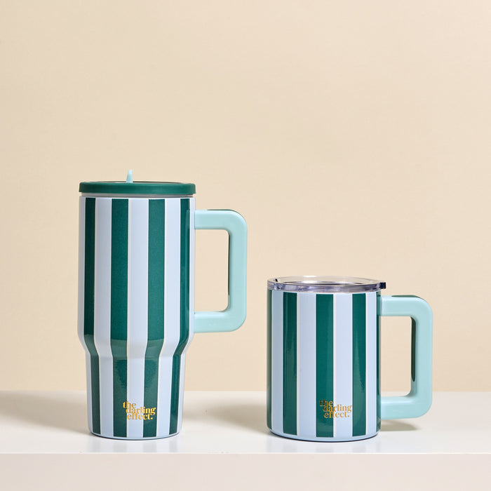 Two mugs with teal and white vertical stripes and light blue handles. The taller is a 20 oz Sicily Stripes Teal Lifestyle Flip Straw Tumbler by The Darling Effect; the shorter has a clear lid. Both have gold text: The Styling Effect.