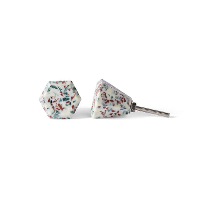 Add a stylish touch with Speckle Geo Knob 3.8cm—two hexagonal cabinet knobs featuring a white base with multicolored flecks and metal screw attachments, perfect as decorative Terrazzo-inspired hardware.