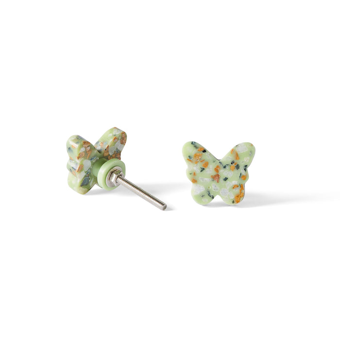 The Speckle Green Butterfly Knob 3.7cm, featuring a terrazzo-inspired green and multicolor speckled design, is shown against a white background—one knob upright and another displaying its post.