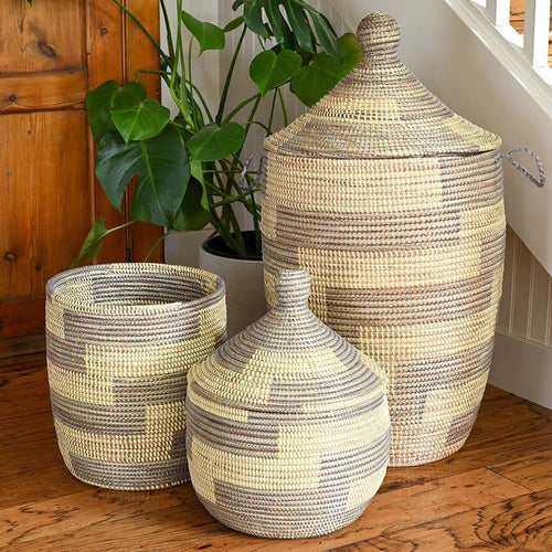 Hand-woven storage baskets on a wooden floor.