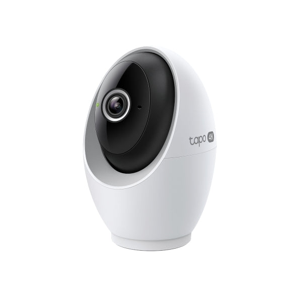 White security camera with black lens on a white background