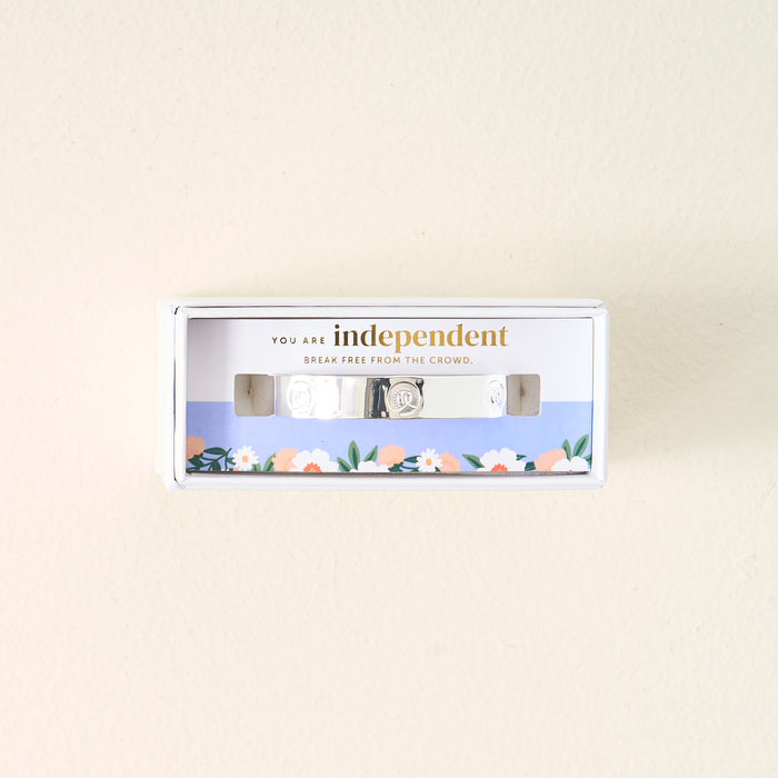 The Darling Effect’s You Are A Leader Cuff Bracelet is shown in floral packaging with the words YOU ARE INDEPENDENT. BREAK FREE FROM THE CROWD—an inspiring and meaningful gift.