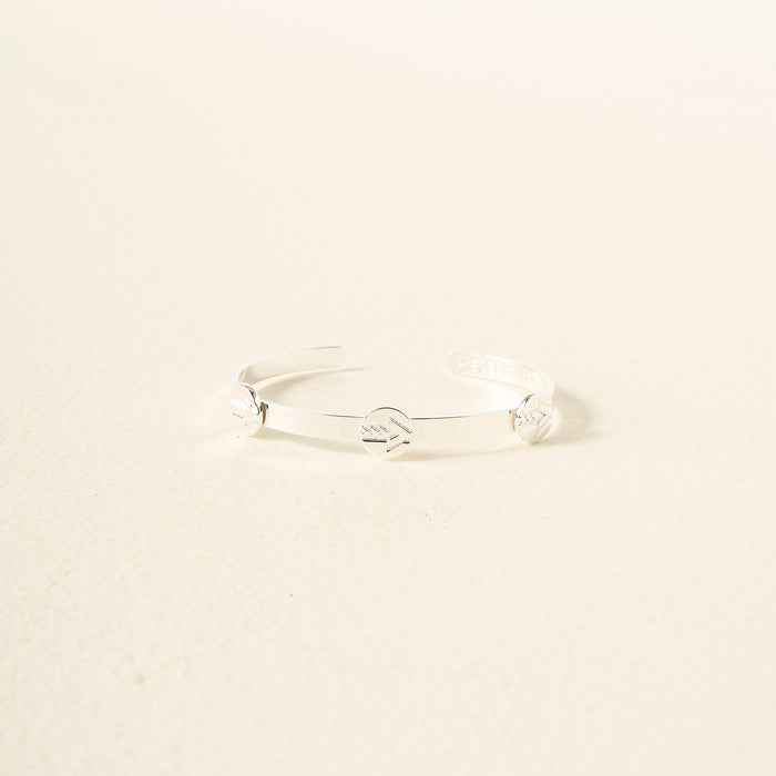 The Darling Effect’s You Are A Leader Skinny Stacker Trait Bracelet features a sleek, adjustable silver cuff with engraved details—an elegant, gift-ready jewelry piece perfect for any occasion.