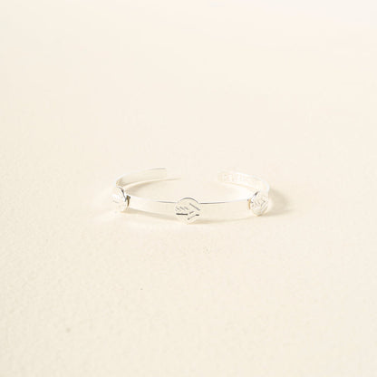 The Darling Effect’s You Are A Leader Skinny Stacker Trait Bracelet features a sleek, adjustable silver cuff with engraved details—an elegant, gift-ready jewelry piece perfect for any occasion.