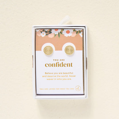 The Darling Effect’s You Are Confident Dainty Stud Earrings arrive gift-ready on a floral card with the message: "You are confident. Believe you are beautiful and deserve the world. Never waver in who you are.