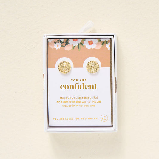The Darling Effect’s You Are Confident Dainty Stud Earrings arrive gift-ready on a floral card with the message: "You are confident. Believe you are beautiful and deserve the world. Never waver in who you are.