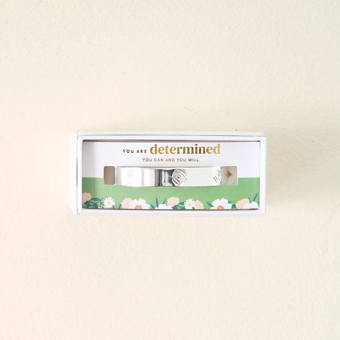 The Darling Effect’s You Are Determined Cuff Bracelet comes in a white floral box with the message “You are determined. You can and you will”—a meaningful gift, perfect for inspiring confidence.