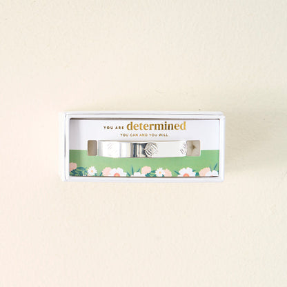 The Darling Effect’s You Are Determined Cuff Bracelet comes in a white floral box with the message “You are determined. You can and you will”—a meaningful gift, perfect for inspiring confidence.