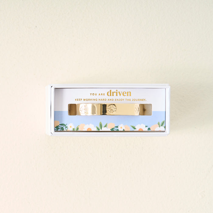The Darling Effect’s You Are Driven Cuff Bracelet comes in a white floral box with “You are driven. Keep working hard and enjoy the journey.” printed inside—a thoughtful, meaningful gift.
