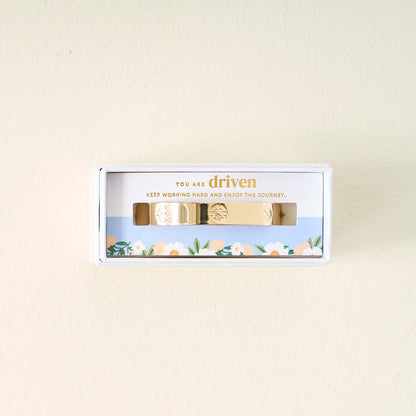 The Darling Effect’s You Are Driven Cuff Bracelet comes in a white floral box with “You are driven. Keep working hard and enjoy the journey.” printed inside—a thoughtful, meaningful gift.