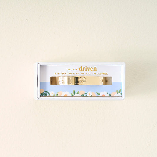 The Darling Effect’s You Are Driven Cuff Bracelet comes in a white floral box with “You are driven. Keep working hard and enjoy the journey.” printed inside—a thoughtful, meaningful gift.