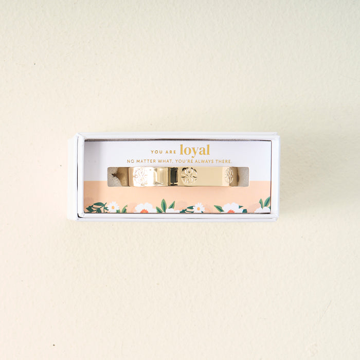 The Darling Effect’s You Are Loyal Cuff Bracelet features floral designs and comes in a white box with “You are loyal. No matter what, you’re always there.” The packaging is accented with a pretty floral motif at the bottom.