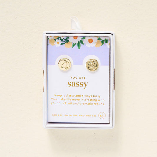The Darling Effect's You Are Sassy Dainty Stud Earrings come in a box on a floral card that says: "You are sassy. Keep it classy and always sassy. You make life more interesting with your quick wit and dramatic replies.