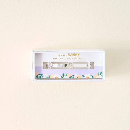 The Darling Effect’s You Are Sassy Skinny Stacker Bracelet comes in a white floral gift box with "You are sassy. Keep it classy and always sassy" printed on it.