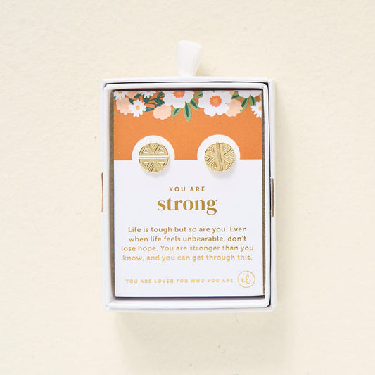 The Darling Effect's You Are Strong Dainty Stud Earrings are shown in a box with a floral-topped card that reads: You are strong. Life is tough but so are you... You are stronger than you know, and you can get through this.