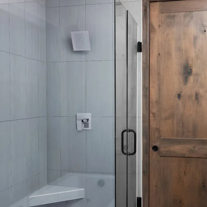 Bathroom with a ZLINE 8 in. Bliss Shower Head in Chrome (BLS-H8-CH) in a glass shower enclosure and wooden door
